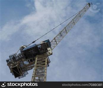 building crane in a construction site over blue sky. construction crane in building site