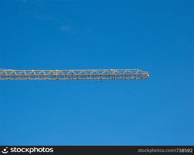 building crane in a construction site over blue sky with copy space. construction crane over sky with copy space