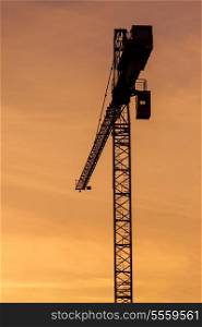 Building crane silhouette in sky on sunset. Munich, Germany