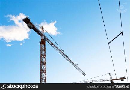 building crane under blue sky in summer evening