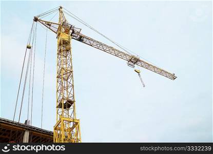 Building crane with the blue sky background