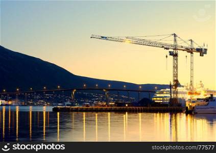 Building cranes in evening Tromso background. Building cranes in evening Tromso background hd
