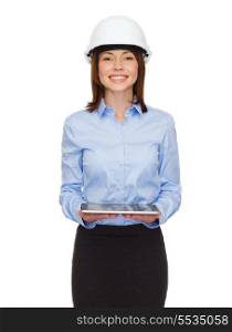 building, developing, consrtuction and architecture concept - friendly young businesswoman in white helmet with tablet pc computer