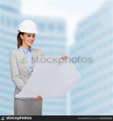 building, developing, consrtuction and architecture concept - friendly young smiling architect in white helmet with blueprints