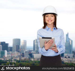 building, developing, consrtuction and architecture concept - friendly young smiling businesswoman in white helmet