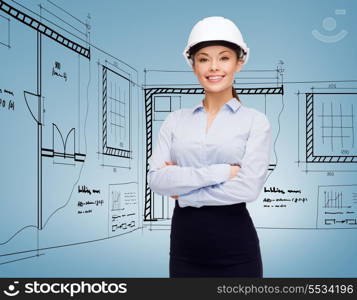 building, developing, consrtuction and architecture concept - friendly young smiling businesswoman in white helmet