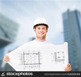 building, developing, consrtuction and architecture concept - male architect in white helmet with blueprint
