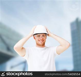 building, developing, consrtuction and architecture concept - picture of male architect in white helmet with safety glasses
