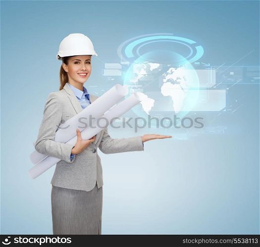 building, developing, consrtuction and architecture concept - smiling architect in helmet with blueprints showing globe hologram on palm of hand