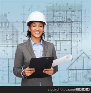 building, developing, consrtuction and architecture concept - smiling businesswoman in white helmet with clipboard and blueprint