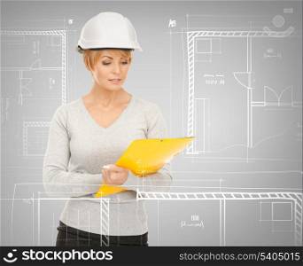 building, developing, consrtuction, architecture concept - female contractor in helmet
