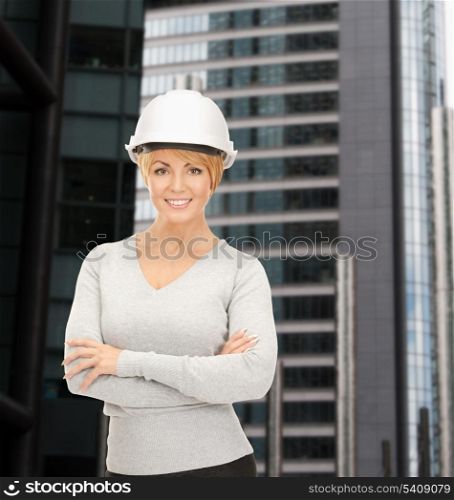 building, developing, consrtuction, architecture concept - female contractor in white helmet