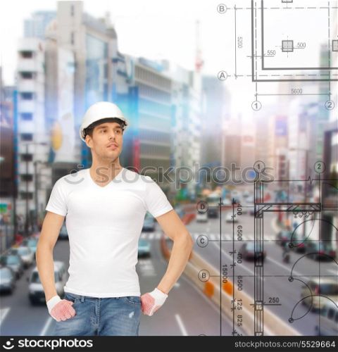 building, developing, consrtuction, architecture concept - handsome builder in white blank t-shirt and helmet