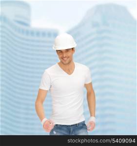 building, developing, consrtuction, architecture concept - handsome builder in white helmet