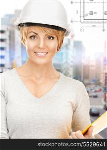 building, developing, construction and architecture concept - female contractor in helmet with folder