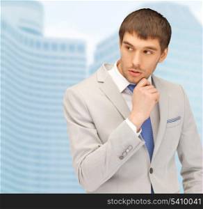 building, developing, construction and architecture concept - handsome businessman