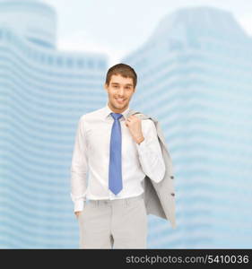 building, developing, construction and architecture concept - handsome businessman in suit