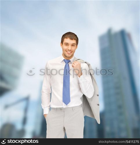 building, developing, construction and architecture concept - handsome businessman in suit