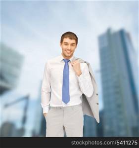 building, developing, construction and architecture concept - handsome businessman in suit