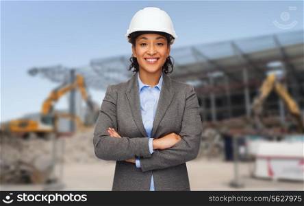 building, developing, construction and architecture concept - smiling african american businesswoman in white helmet