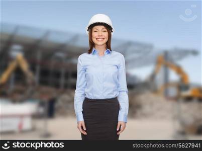 building, developing, construction and architecture concept - smiling businesswoman in white helmet