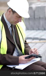 building engineer in yellow hard hat