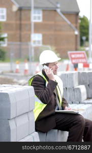 building engineer in yellow hard hat