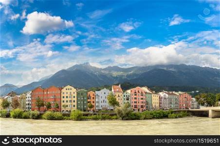 Building facade and Alps mountains behind in Innsbruck in a beautiful summer day, Austria