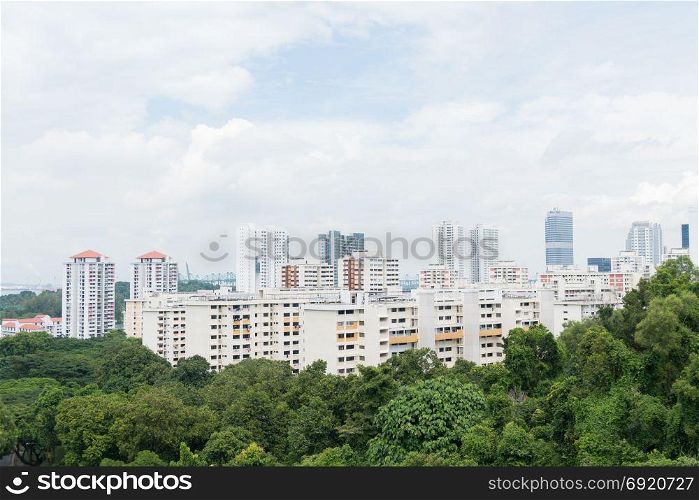 Building in Singapore city. Building in tree of park. cloud clear sky.