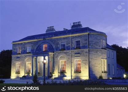 Building lit up at night, St. Clerens, Galway, Republic of Ireland