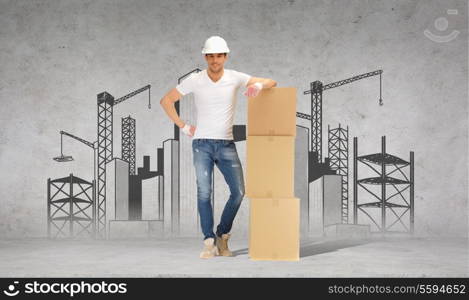 building, moving and postal concept - smiling man in helmet and gloves with tower of cardboard boxes