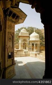 Building viewed from an arched doorway, Royal Gaitor, Jaipur, Rajasthan, India