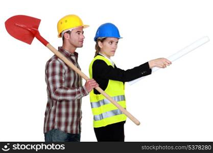 Building worker and woman supervising work on white background
