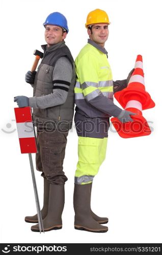 Building workers standing on white background