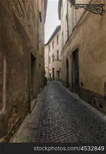 Buildings along a narrow cobblestone street, Orvieto, Terni Province, Umbria, Italy