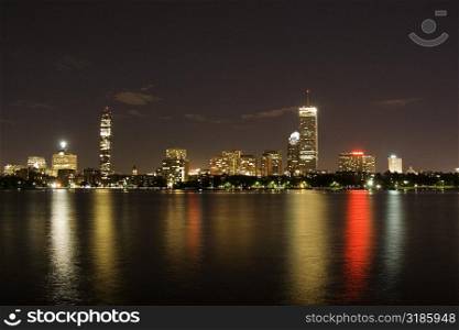 Buildings at the waterfront lit up at night, Boston, Massachusetts, USA