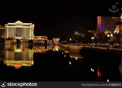 Buildings at the waterfront lit up at night, Las Vegas, Nevada, USA