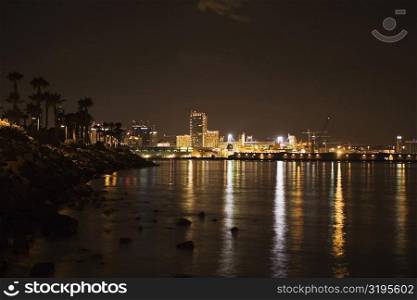 Buildings at the waterfront lit up at night, San Diego, California, USA