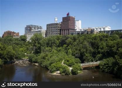 Buildings by Mississippi River, Minneapolis, Hennepin County, Minnesota, USA