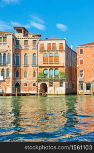 Buildings by the water on The Grand Canal in Venice on sunny summer day, Italy