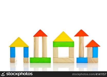 Buildings constructed out of toy wooden building blocks