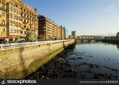 Buildings in a city by the river, Spain