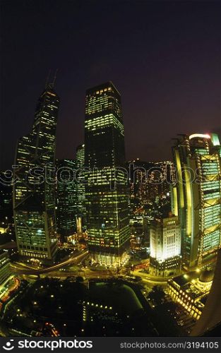 Buildings in a city lit up at night, Hong Kong, China