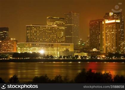 Buildings in a city lit up at night, New Orleans, Louisiana, USA