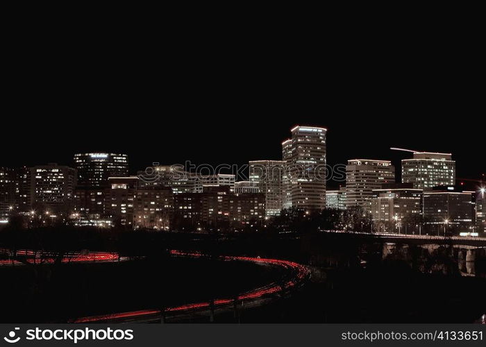 Buildings in a city lit up at night, Washington DC, USA