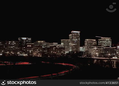 Buildings in a city lit up at night, Washington DC, USA