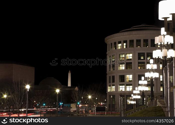 Buildings in a city lit up at night, Washington DC, USA