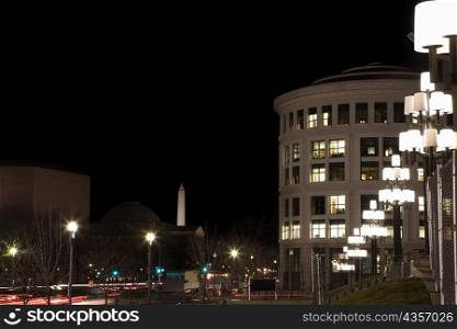 Buildings in a city lit up at night, Washington DC, USA