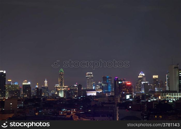 Buildings in the city of Bangkok at night. The building and the tallest building in the city.