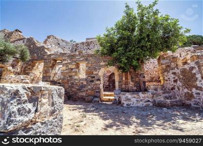 Buildings in the fortress on the island of Spinalonga at the Gulf of Elounda, Crete, Greece. Here were isolated lepers, humans with Hansen&rsquo;s disease.. Buildings in the fortress on the island of Spinalonga at the Gulf of Elounda, Crete, Greece.